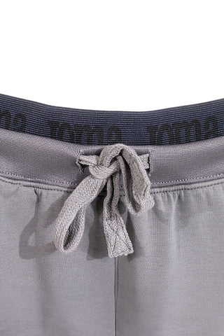 Sive jogger hlače z elastičnim pasom in silikonskim logotipom JOMA Step Long Pants