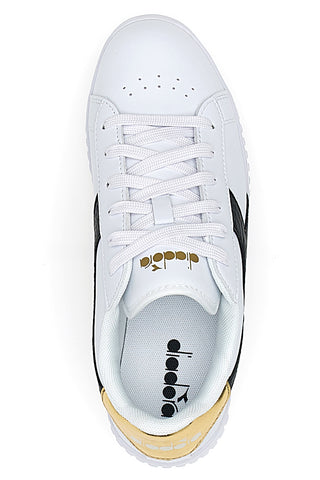 Bele superge z črnim in zlatim logotipom DIADORA GAME STEP SKIN GS