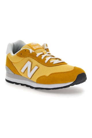 Rumene superge z logotipom na strani New Balance 515