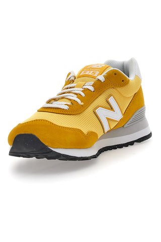 Rumene superge z logotipom na strani New Balance 515