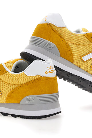 Rumene superge z logotipom na strani New Balance 515
