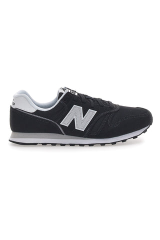 Črni športni copati z logotipom New Balance 373 na strani