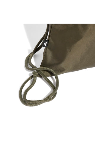 Zelena torba z logotipom Adidas Linear Gymsack na sprednji strani