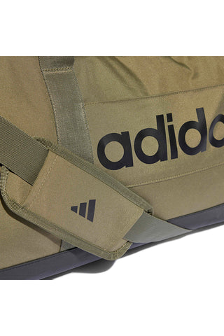 Zelena torba z logotipom Adidas Linear Duffel na strani